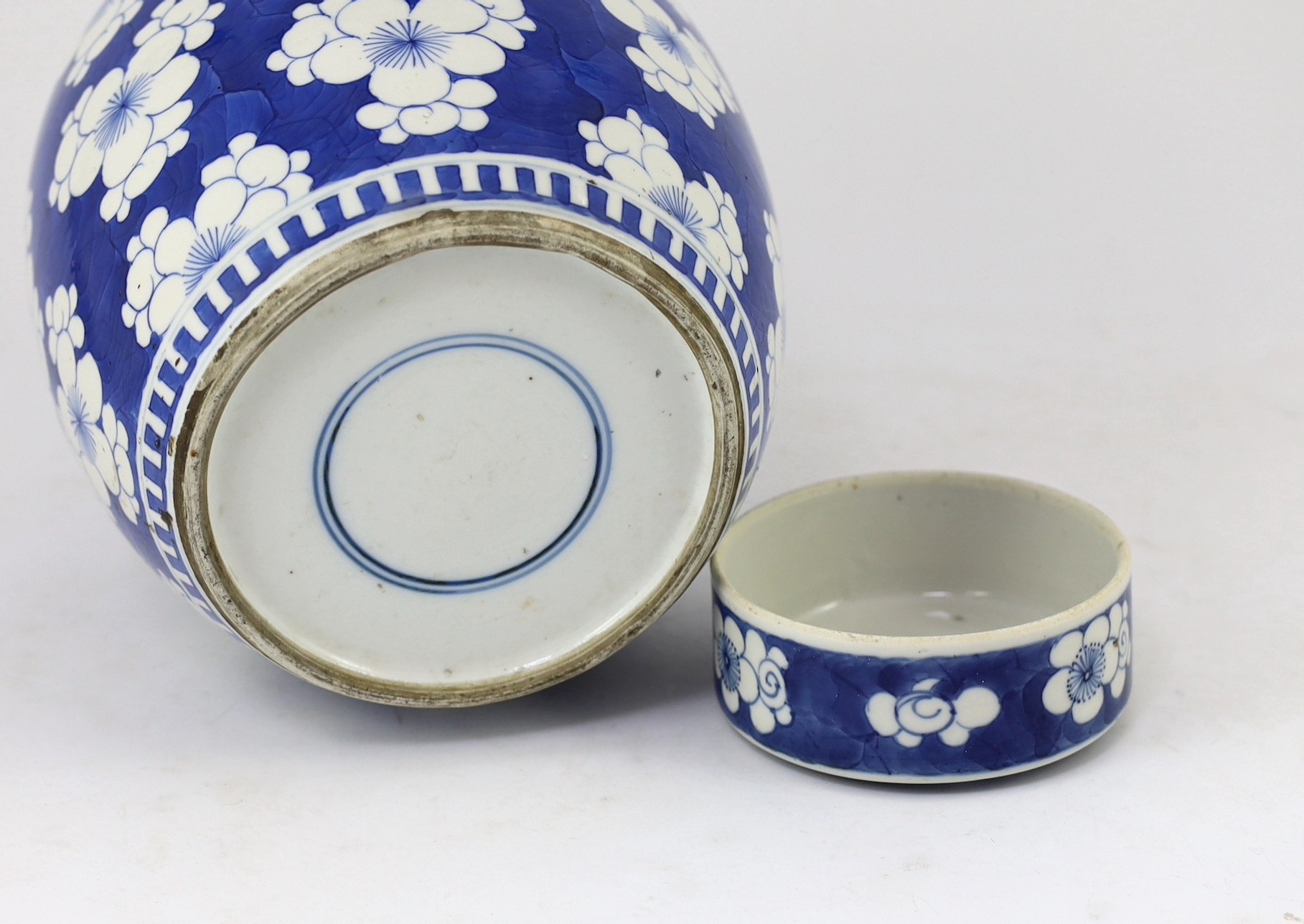 A Chinese blue and white prunus jar and cover, 19th century, 25cm high, cover associated